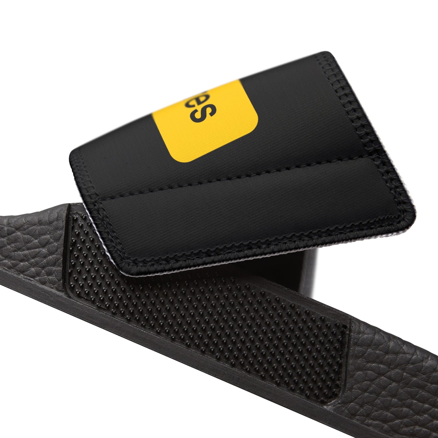 Removable strap on black Slides with the words Arrivals and Departures on each foot