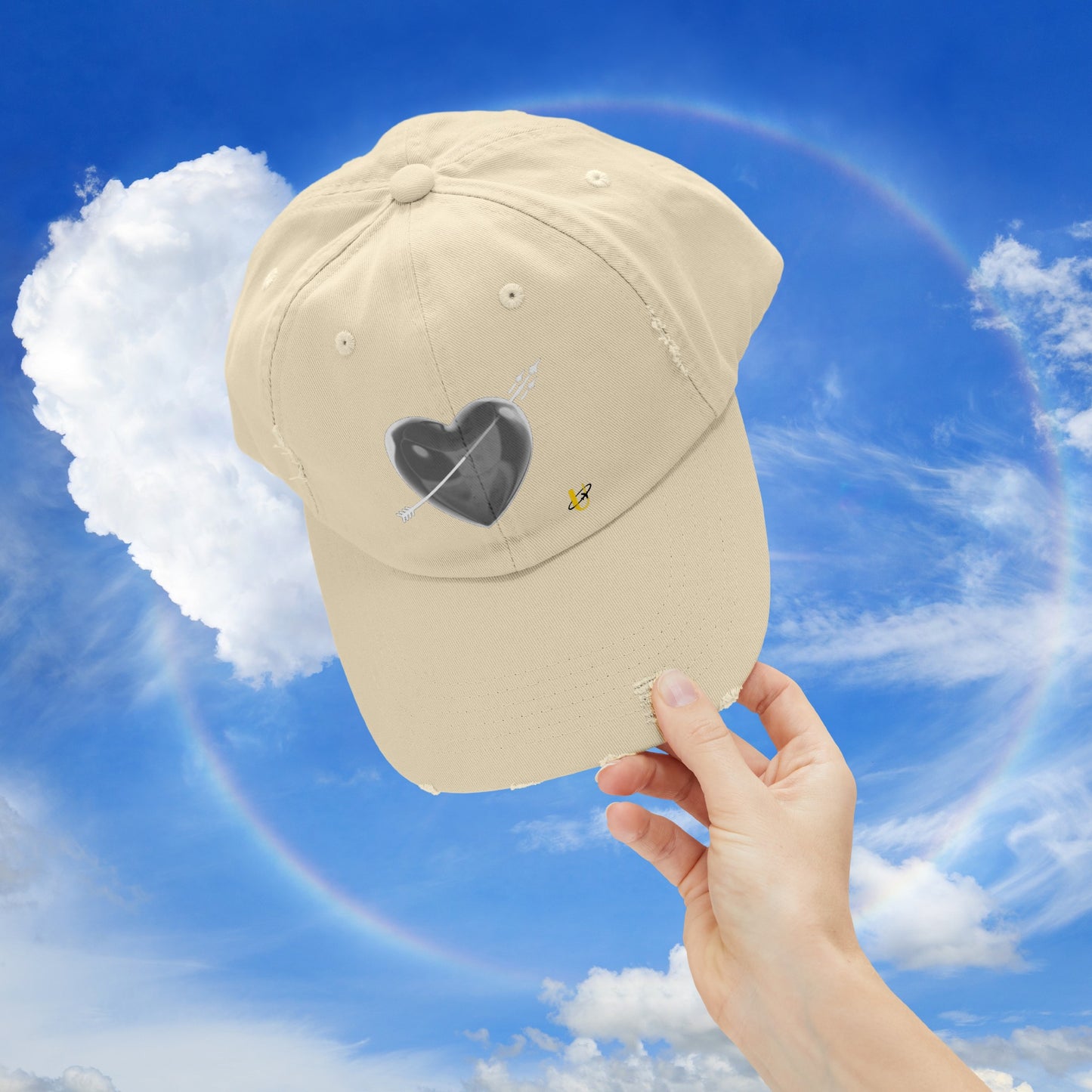 stone "Love Jet" hat being held up in the sky