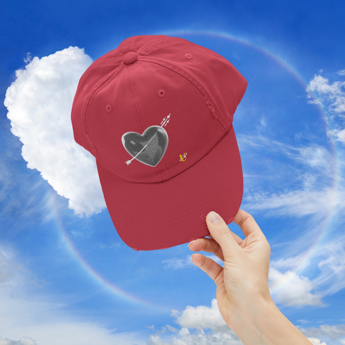 dashing red "Love Jet" hat being held up in the sky