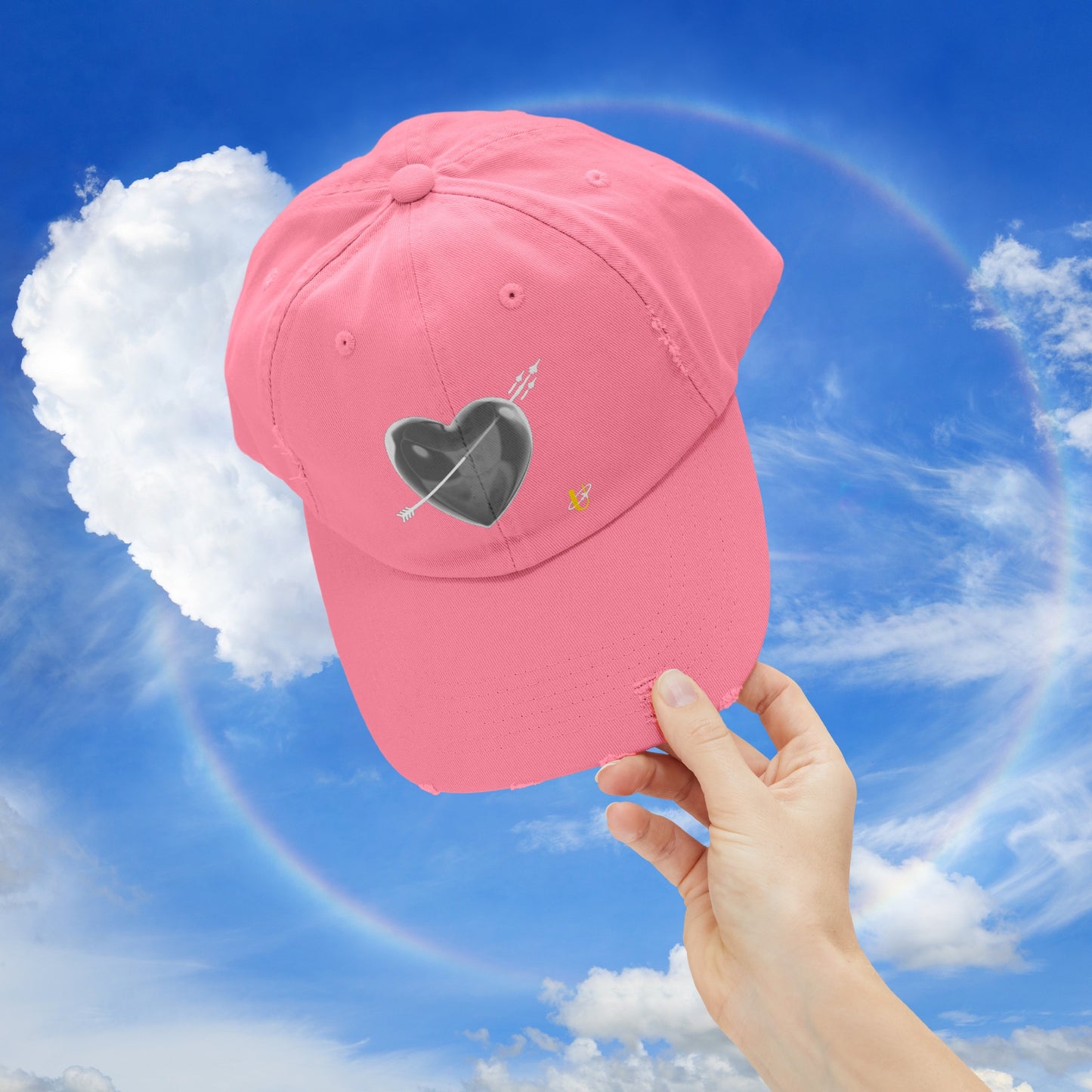 true pink "Love Jet" hat being held up in the sky