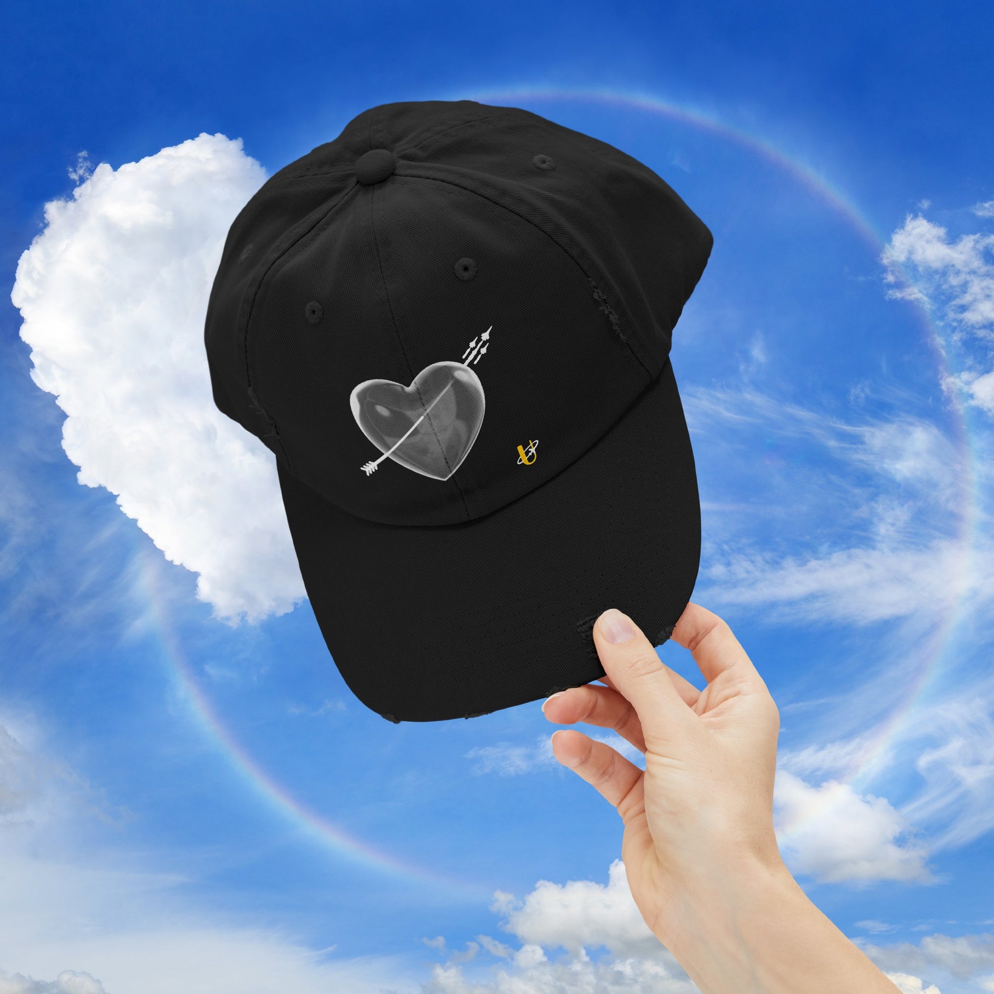 black "Love Jet" hat being held up in the sky